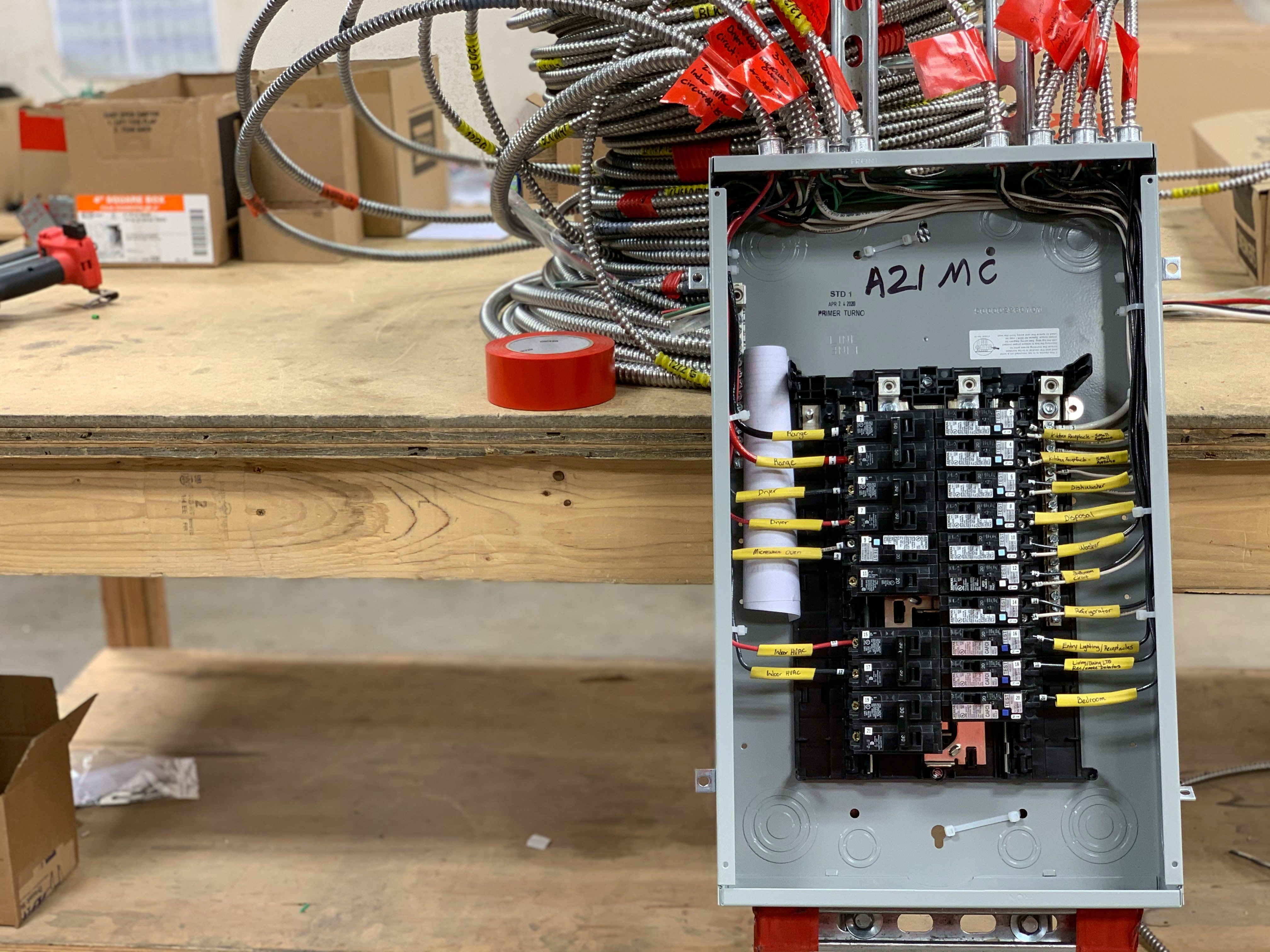 Journeyman electrician pulling wire on job site