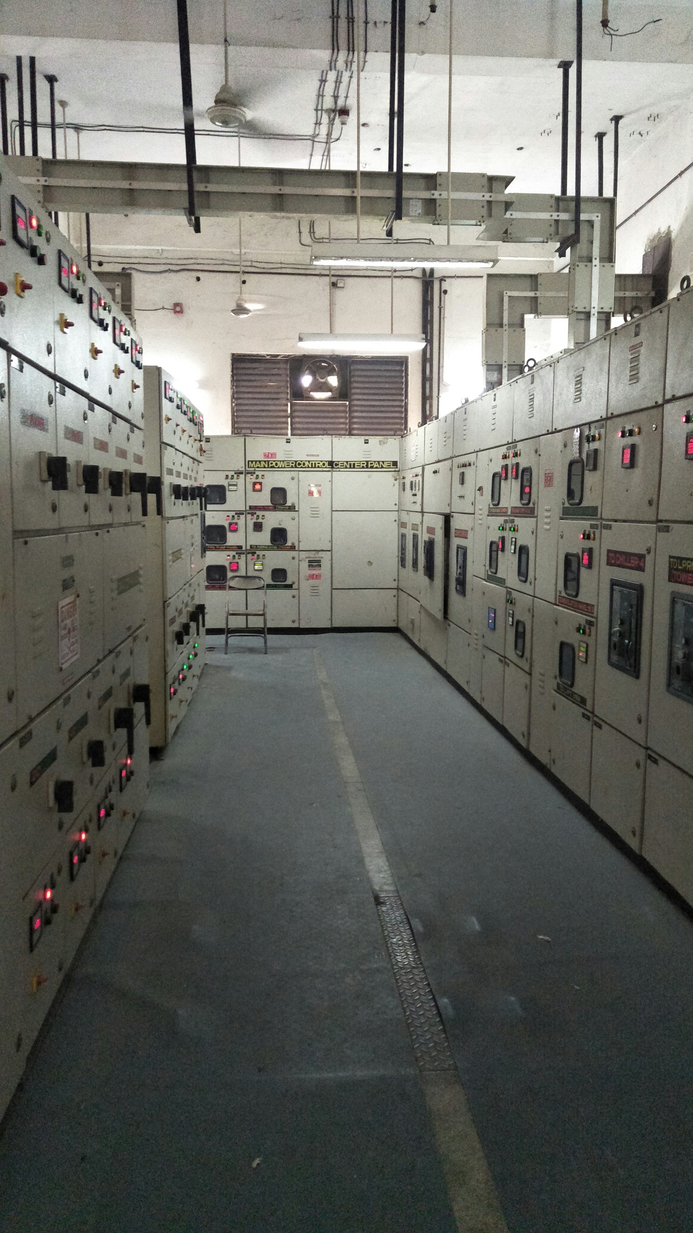 Inspector reviewing electrical work for code compliance